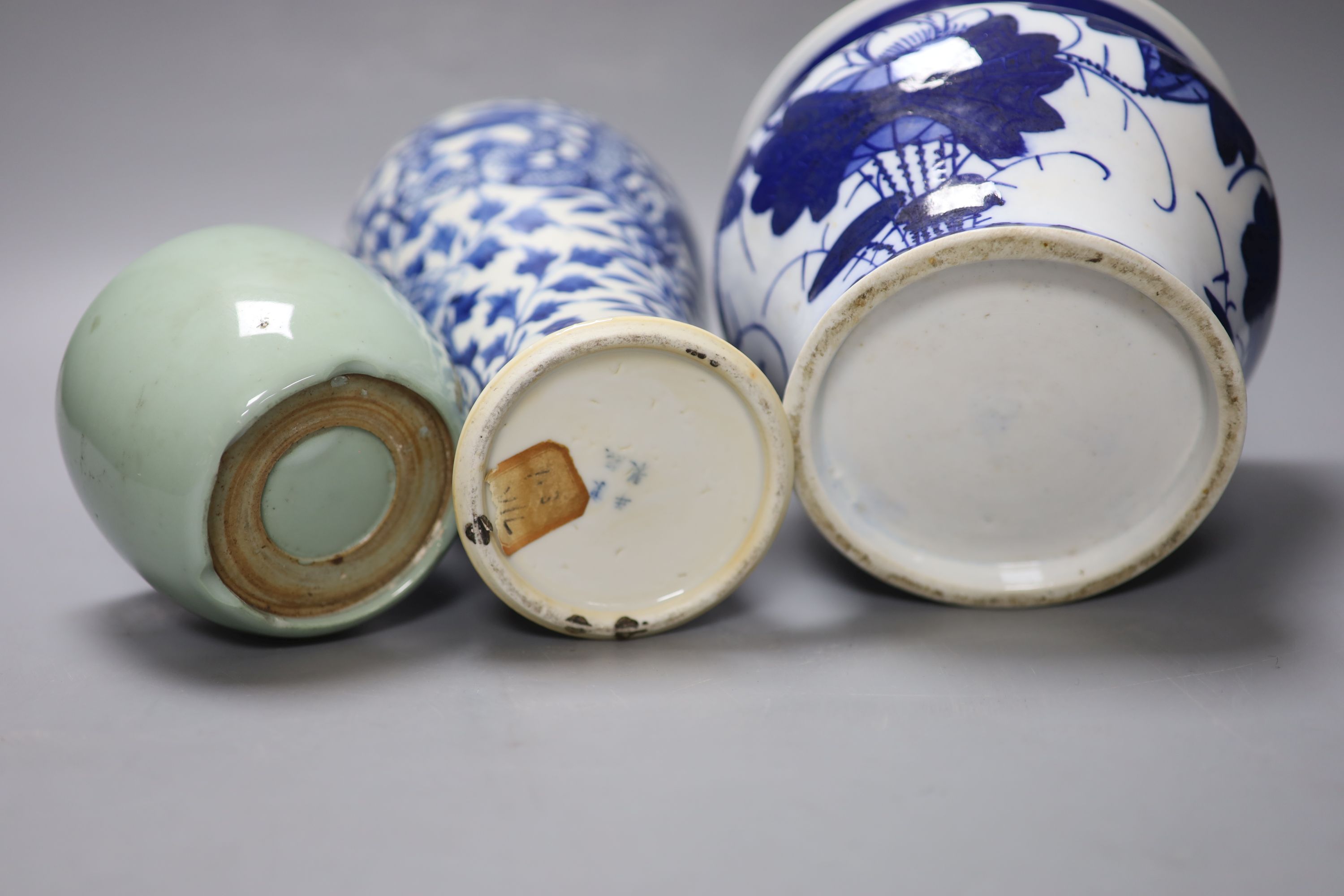 A Chinese blue and white dragon vase with Kangxi mark, together with a blue and white jardiniere and a celadon glazed bowl